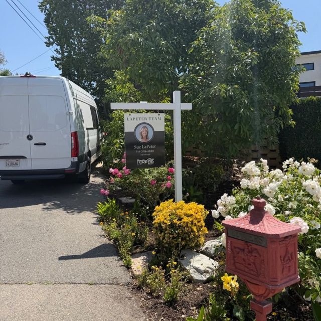 R.E.S.S. installation van on site during a real estate sign install
